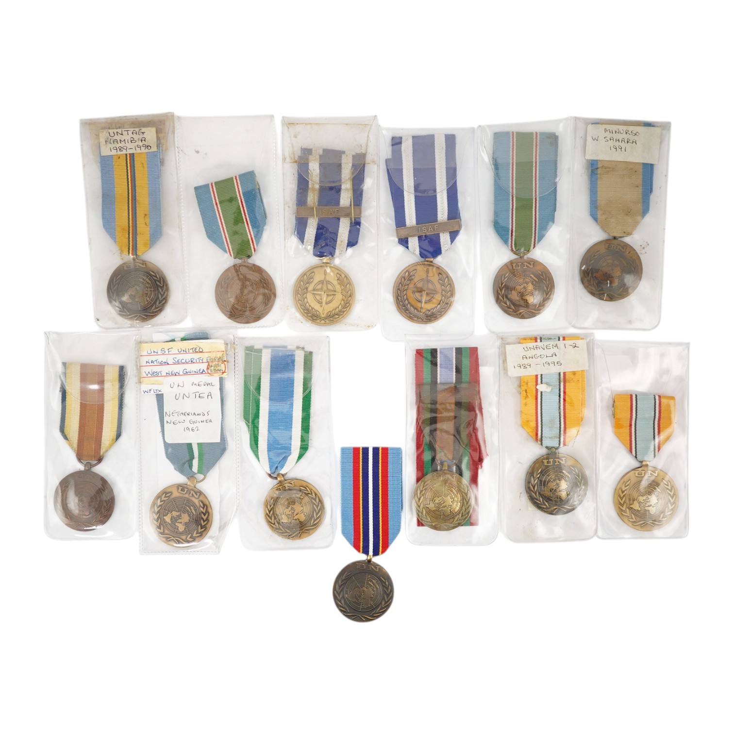 Thirteen United Nations (UN) and NATO medals, eleven UN examples with ‘ in the service of peace’ to the reverse, including a variety of ribbons for a number of different campaigns, (some duplicates), and two NATO ISAF Af